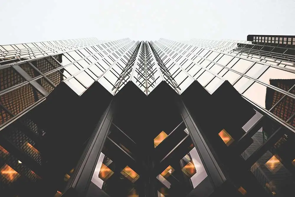 An image of a company building with glass windows.